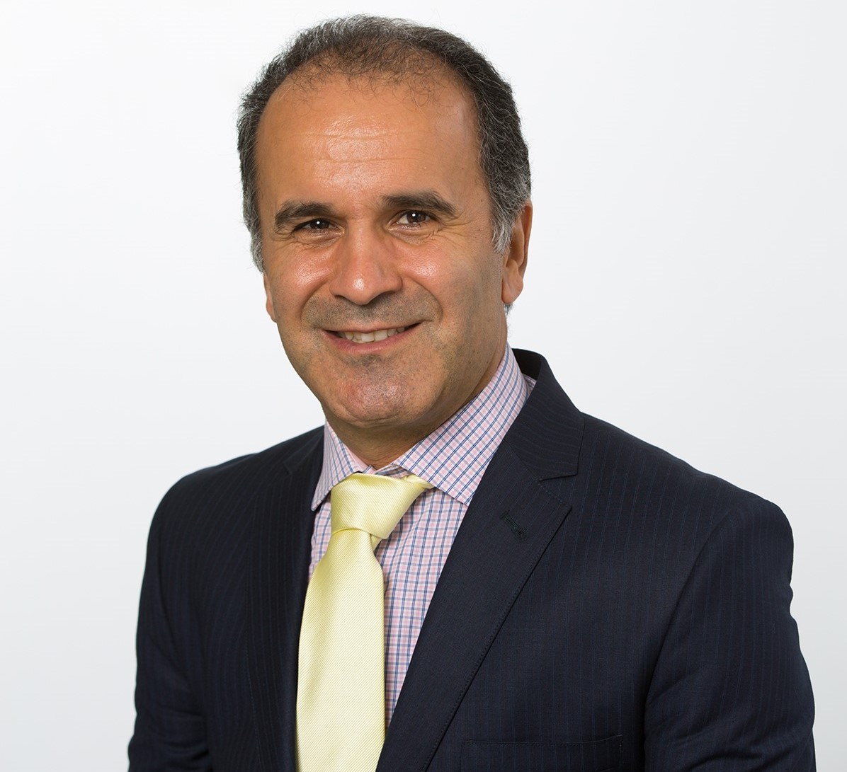 Headshot of Mahdi Zoorabadi who has short dark hair and is wearing a suit and tie.
